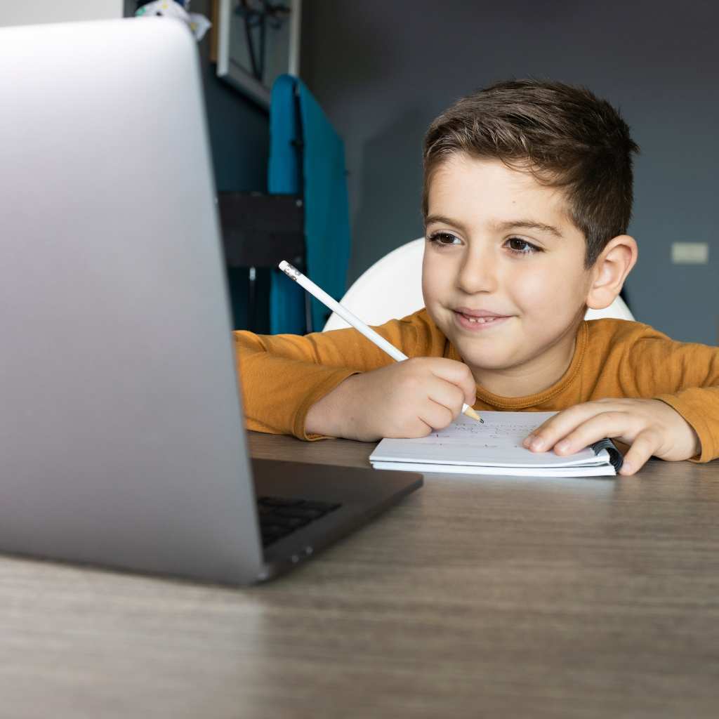 Little boy attending an online autism assessment