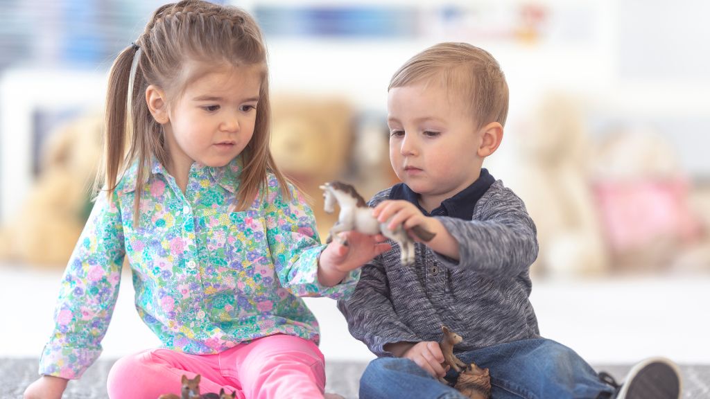 Toddlers playing together during ABA therapy for autism support